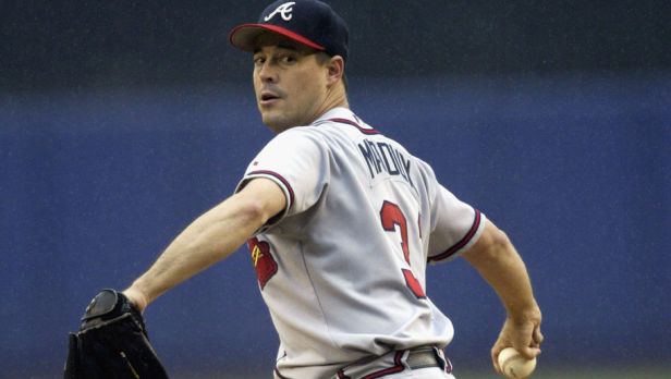 Greg Maddux delivers the ball